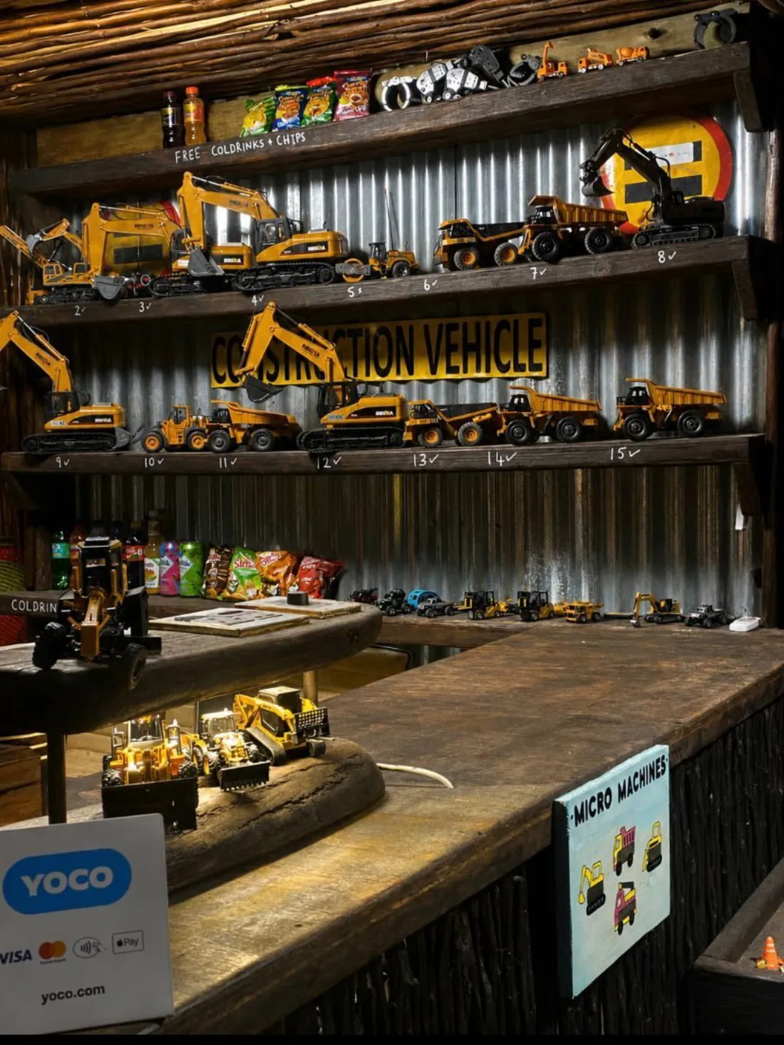 Shelf of numbered remote-control construction vehicles